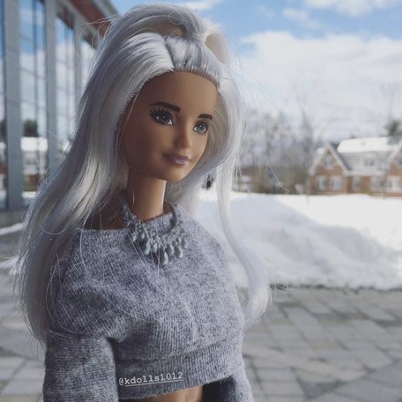 Doll standing outside of school library